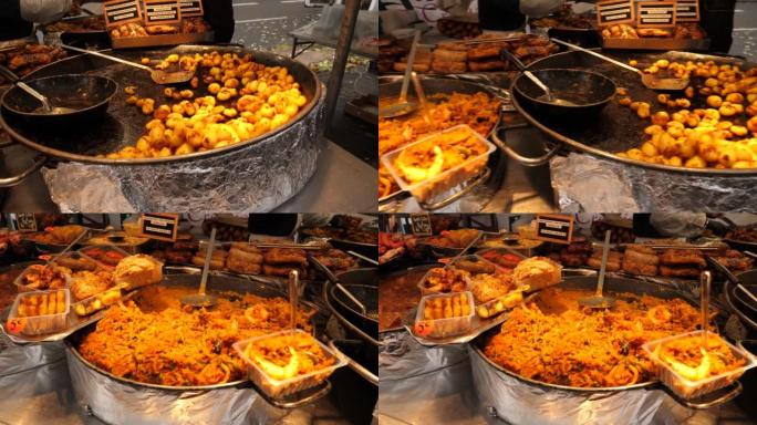 巴黎街头食品市场布局即食餐土豆和肉类、米饭等