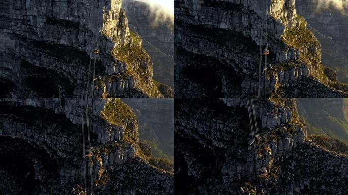 一辆缆车从山崖上下来的电影空中镜头