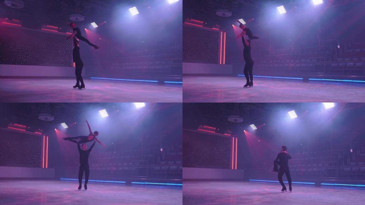花样滑冰运动员一对在溜冰场上进行侧向支撑的顶升旋转，手臂和腿伸出，绕轴旋转，在霓虹灯泛光灯下对角拍摄