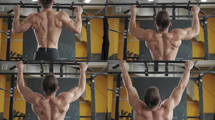 肌肉发达的运动员在健身房锻炼背部肌肉做引体向上