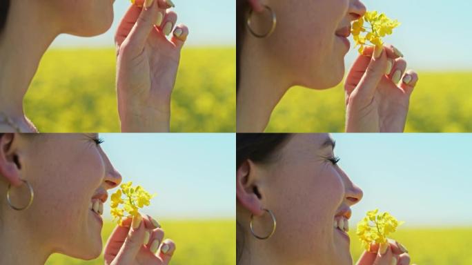 4k视频片段，一名年轻女子在乡下闻一朵花