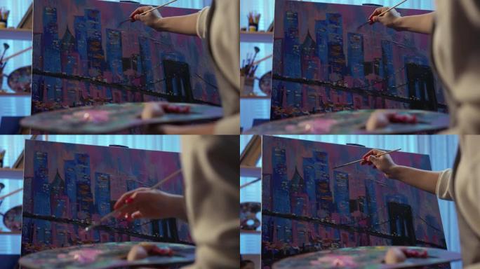 女人的手用画笔在画布上用油画画一幅画。一位富有创造力的女艺术家在艺术工作坊中创作，将笔触应用于画布。
