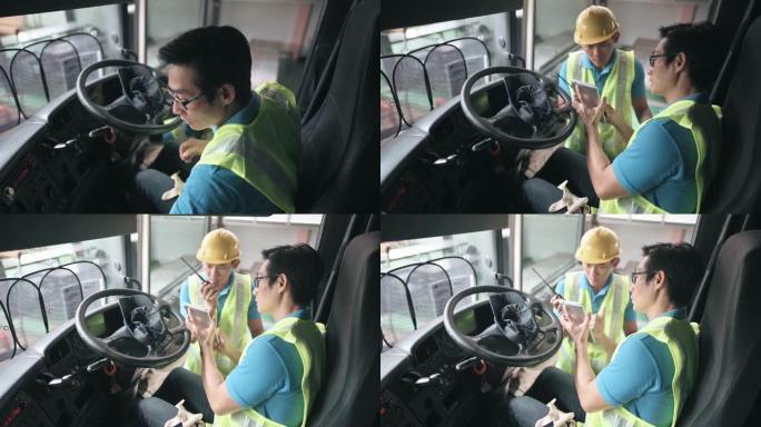 亚洲中国半卡车司机与工厂仓库工人就交货装载清单进行沟通