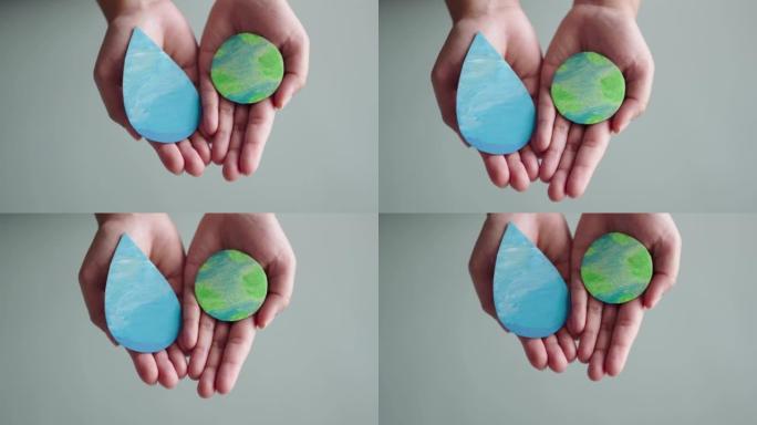 手握可持续元素。可持续性、节水理念