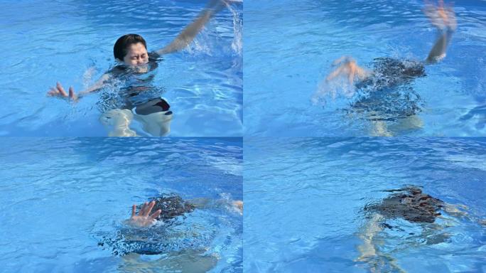 亚洲妇女溺水在游泳池中因抽筋而发生在她的腿上。