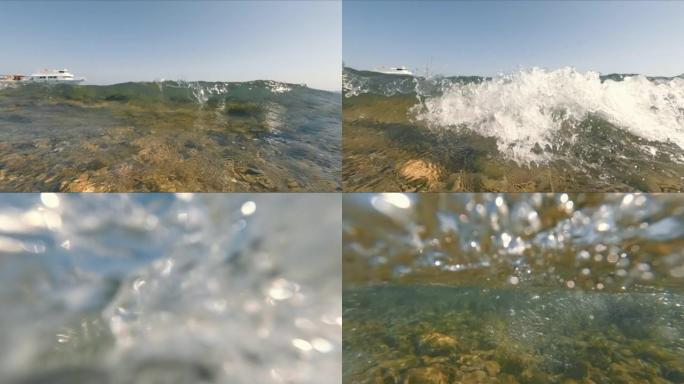 海浪到达岸上并覆盖了相机镜头。水下世界的景色。暴风雨使图像变形