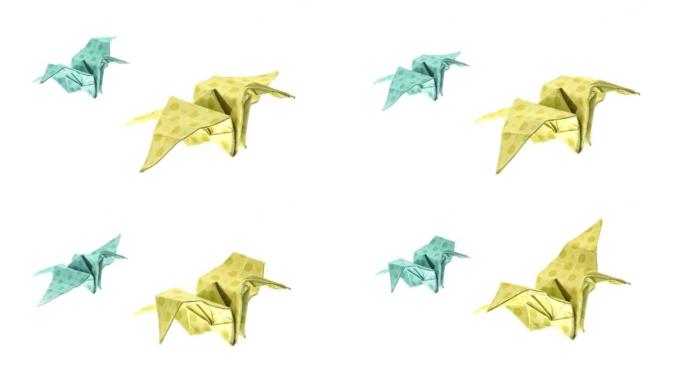 美丽的折纸鹤动画。白底飞行的折纸鹤。画廊上的不同颜色