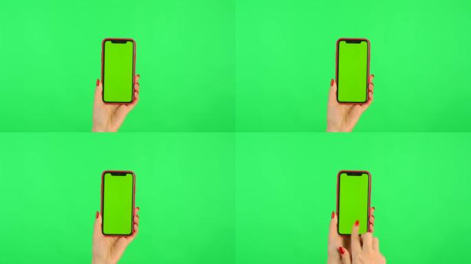 女人将带有工作区模拟屏幕的手机放在垂直位置的绿色背景上。女性手触摸、点击、滑动、拖动和滑动。特写