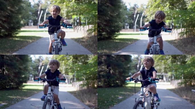 在阳光下骑自行车的小男孩