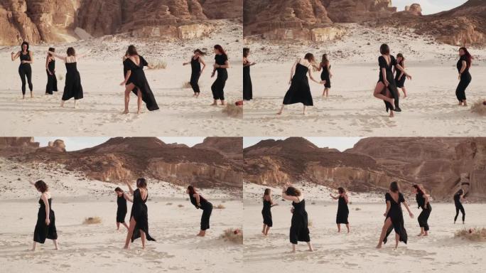 令人惊叹的沙漠景观，一群妇女在练习狂喜的舞蹈