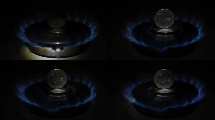 一欧元硬币站在一个热气腾腾的煤气炉上