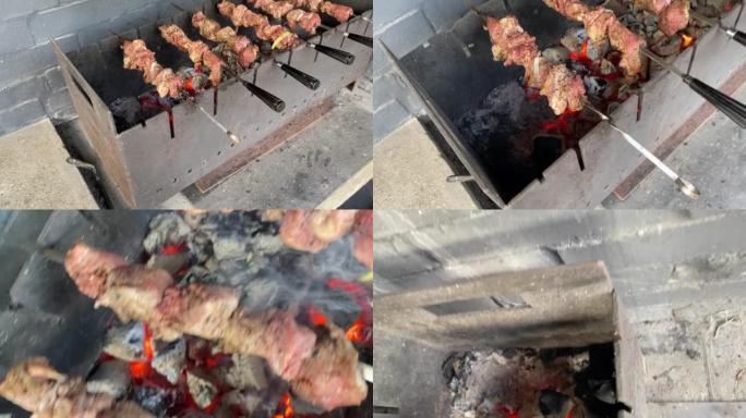 猪肉烤肉串在木炭上的金属烤架上油炸