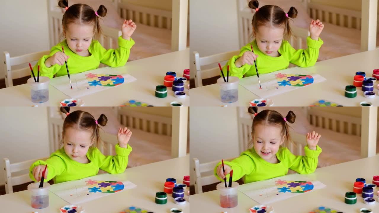 小女孩用水彩和水粉在纸上画了一颗心。