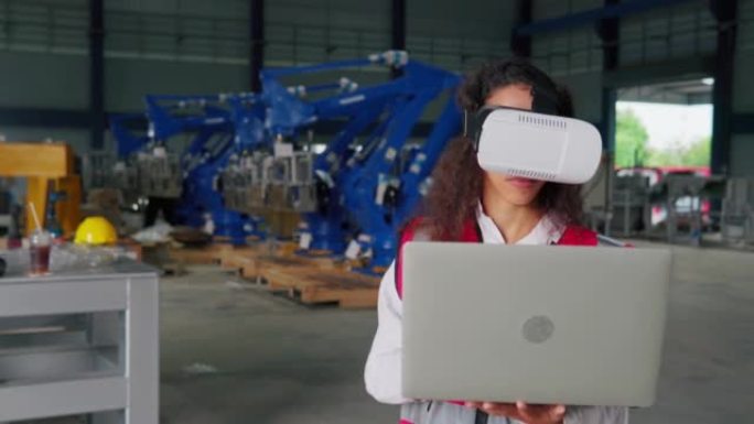 工程师使用VR眼镜来控制机器人手臂，以便在工厂安装。