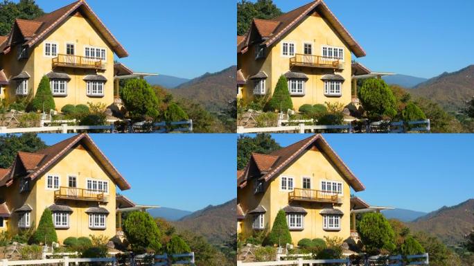 美丽的乡村乡村小屋的外部景观和花园草坪