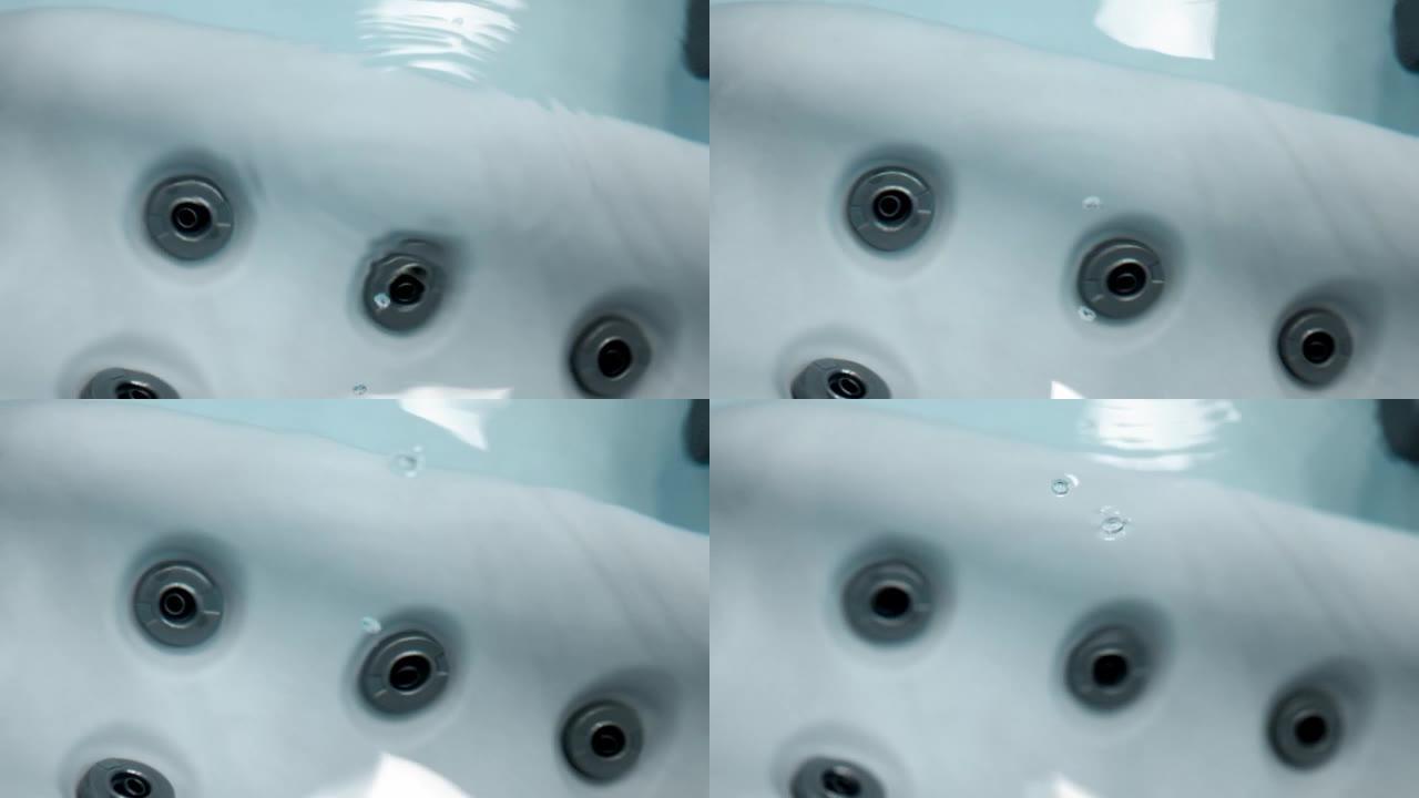 热水浴缸中冒泡的水纹理的特写
