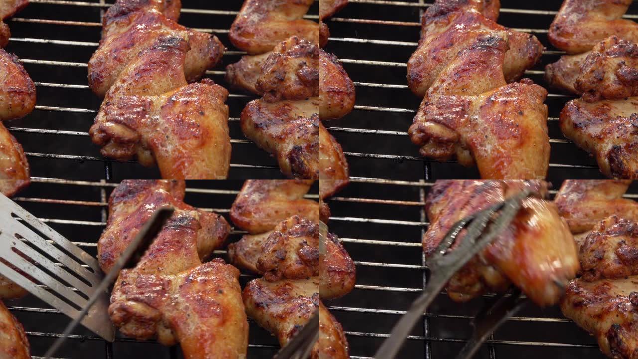 在烤架上旋转的木串上开胃的鸡翅特写