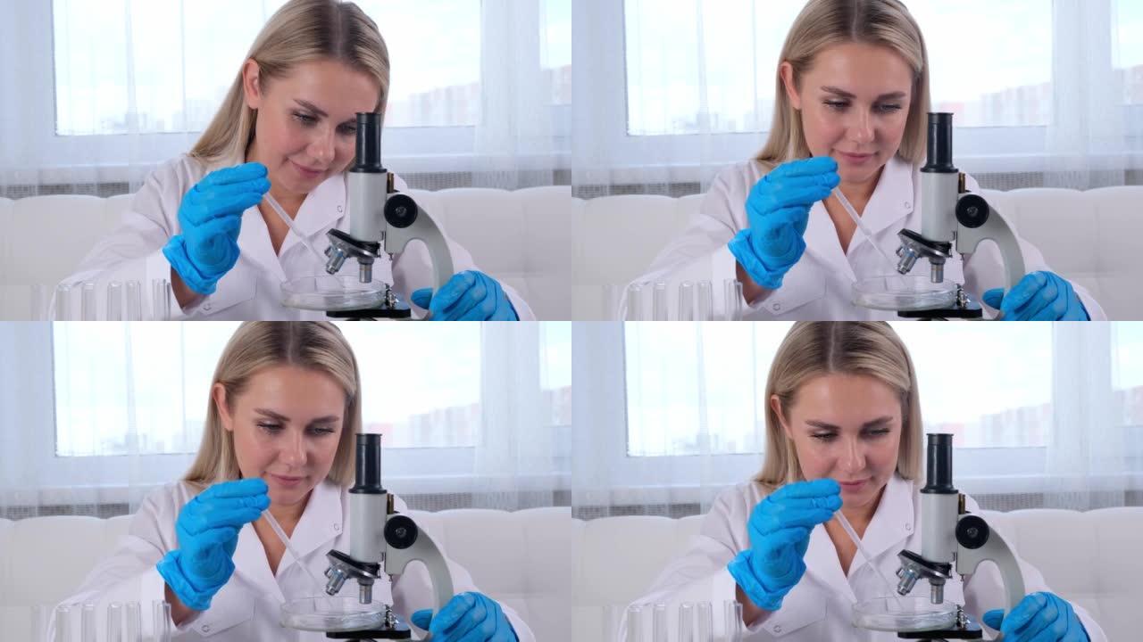 女实验室助理在实验室的桌子上工作时使用显微镜分析样品，进行研究