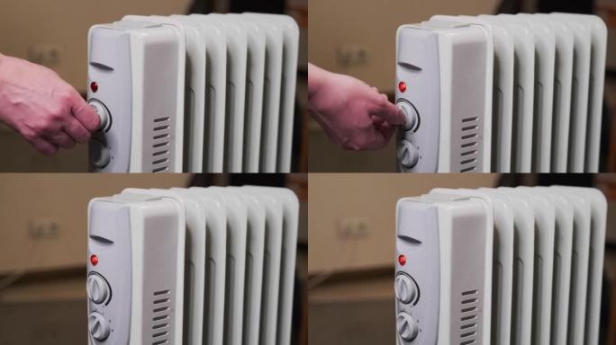 家庭主妇在寒冷的天气里打开电热器。昂贵的电力。