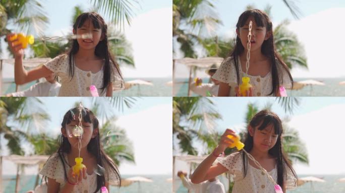 亚洲女婴吹肥皂泡三亚海南岛大东海旅游区