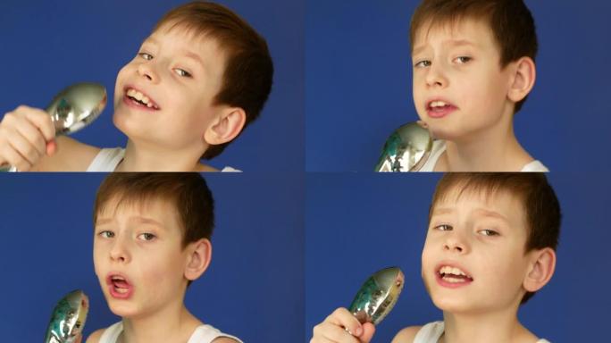 顽皮的高加索男孩6-7岁拿着淋浴麦克风在浴室唱歌，在浴室里欢快地唱歌。这个男孩模仿在浴室里唱歌。工作