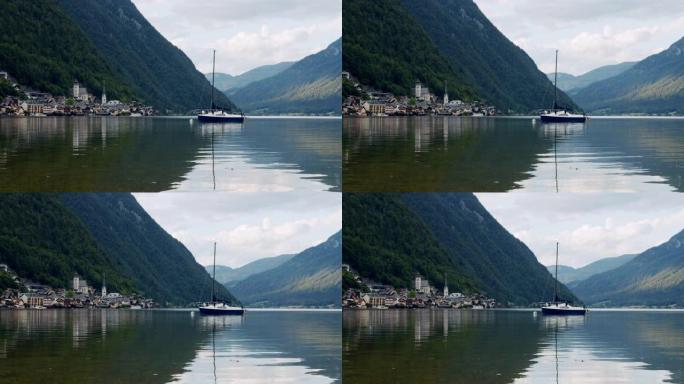 湖泊中的游船，背景是奥地利的哈尔斯塔特村，背景是奥地利的哈尔斯塔特村，背景是奥地利的哈尔斯塔特村