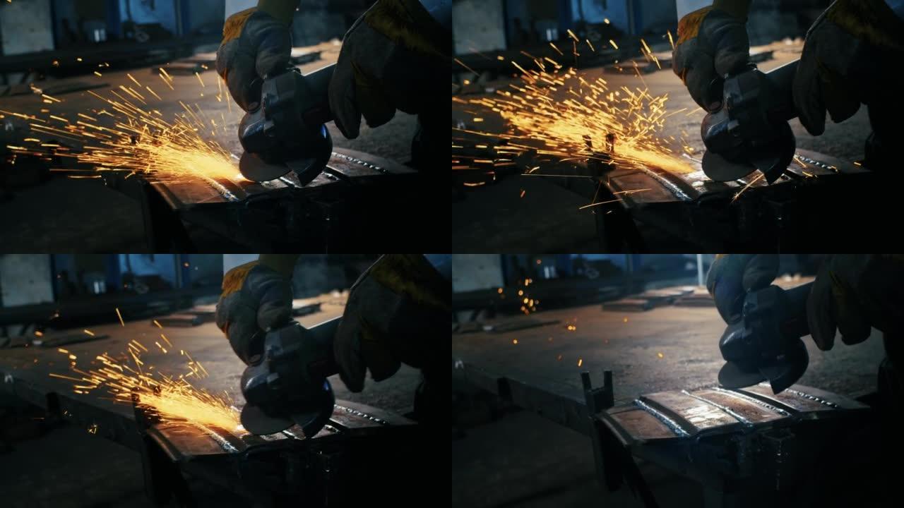 组装金属结构，由专业工人使用研磨机自制防弹衣板。在室内的重工业工厂中，用光滑的金属，铁，火花设备进行