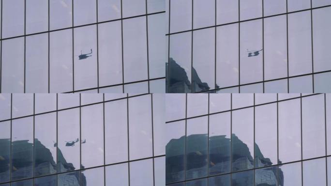 4k慢动作60fps中直升机飞行在玻璃建筑上的反射