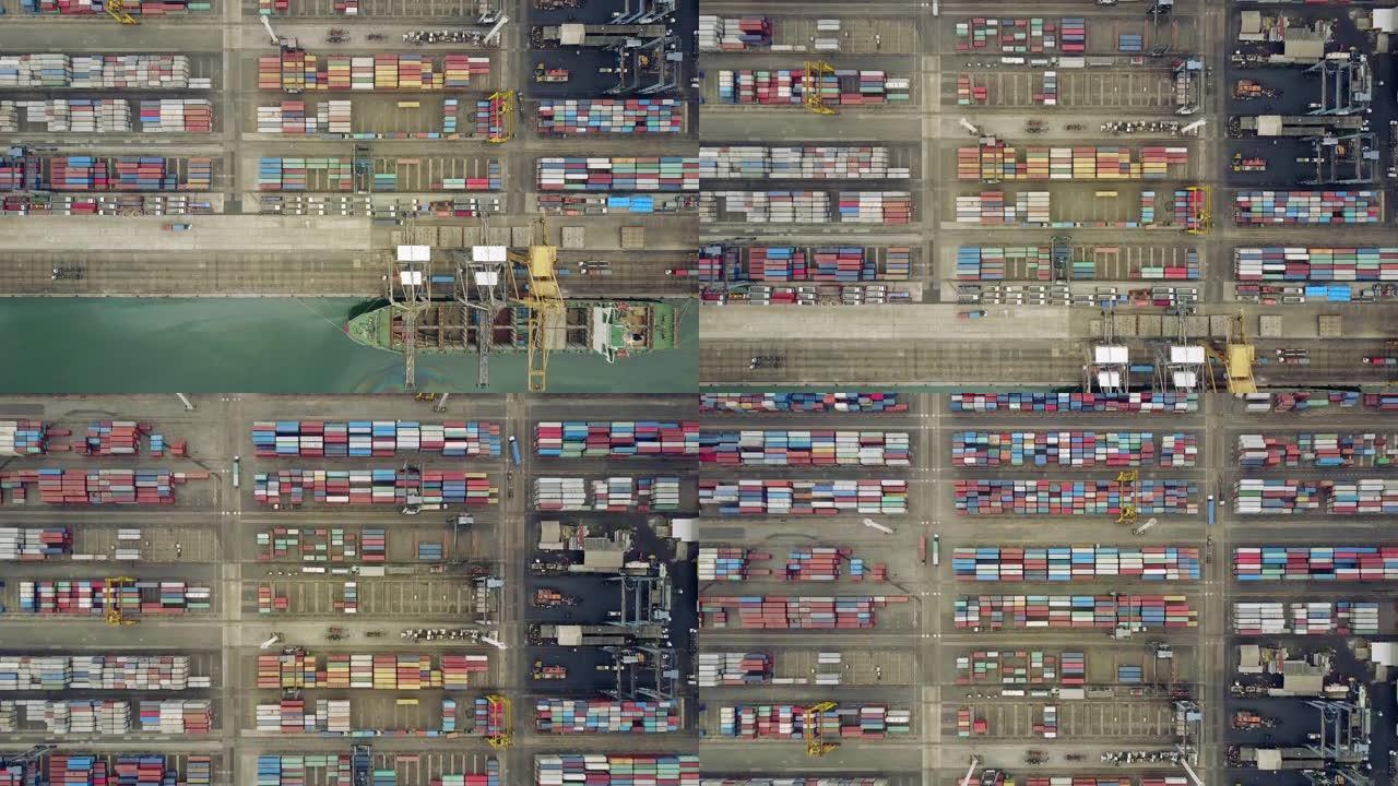 印度尼西亚雅加达。2017年7月10日: 丹绒普里约克工业港装有起重机和集装箱的货船的俯视图镜头。以