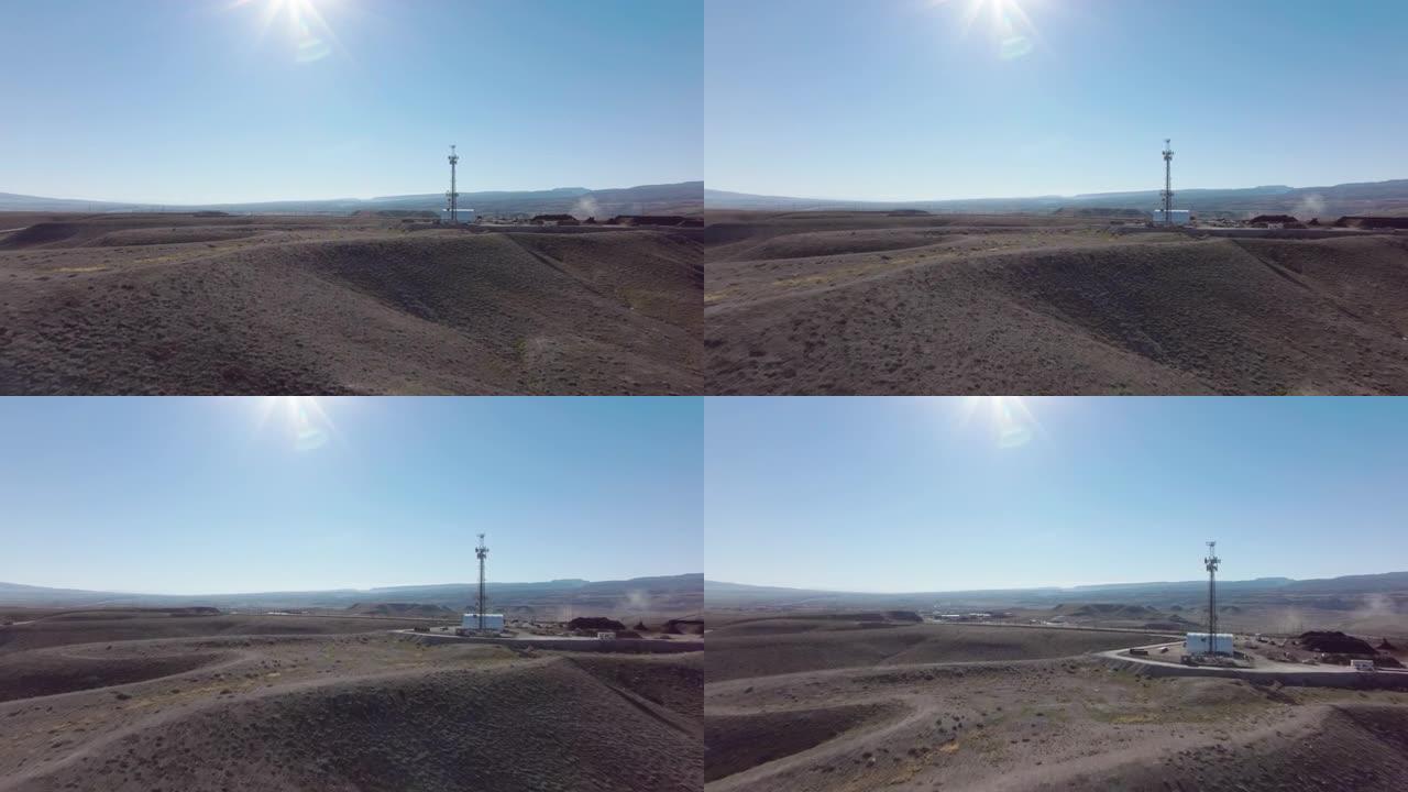 在冬天的一个阳光明媚的日子里，空中推射向科罗拉多州沙漠中的5g电信塔