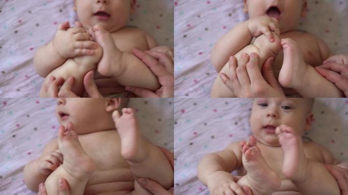 刚出生的裸着尿布的小宝宝笑得很滑稽，仰面躺着。快乐活泼的人像小儿咬脚趾按摩药小儿科做简单的锻炼骨骼肌