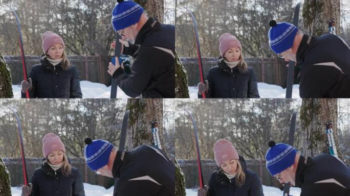 父女打蜡准备滑雪板