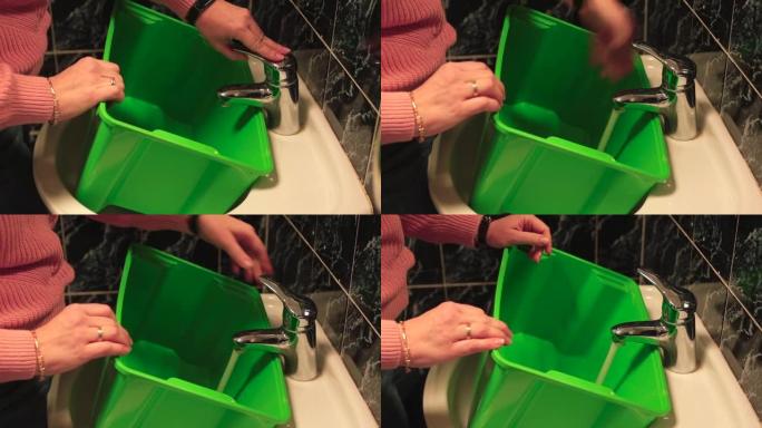 将水倒入绿色容器中。检查饮用液体的质量。