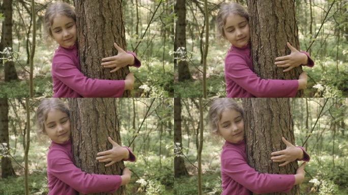 拯救地球绿色星球。儿童女孩在公园拥抱树干，热爱大自然生活。心满意足的小女孩拥抱着大树，表达着自然保护
