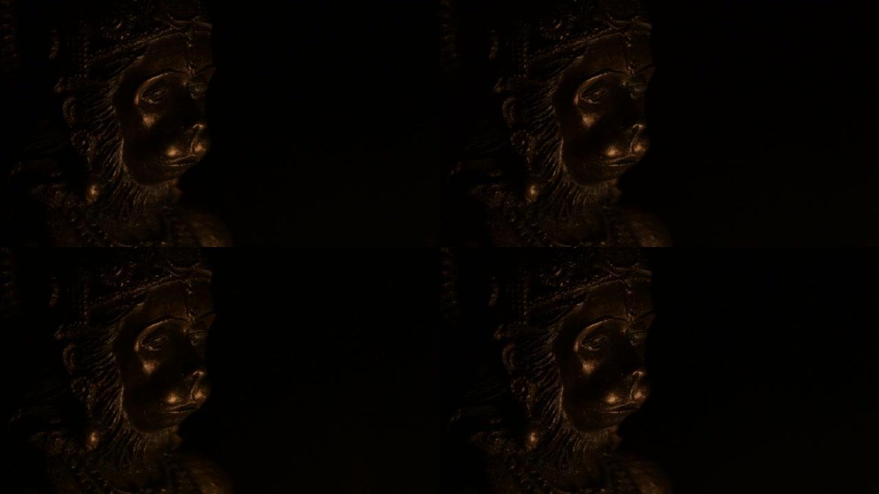 哈努曼脸，印度教的神，用蜡烛的光照亮