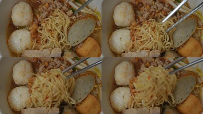 不锈钢筷子采摘鸡蛋黄面面条打顶片煮猪肉和球在辣冬阴汤