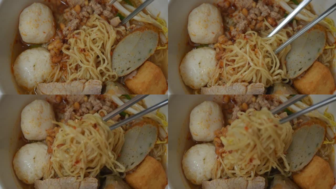 不锈钢筷子采摘鸡蛋黄面面条打顶片煮猪肉和球在辣冬阴汤