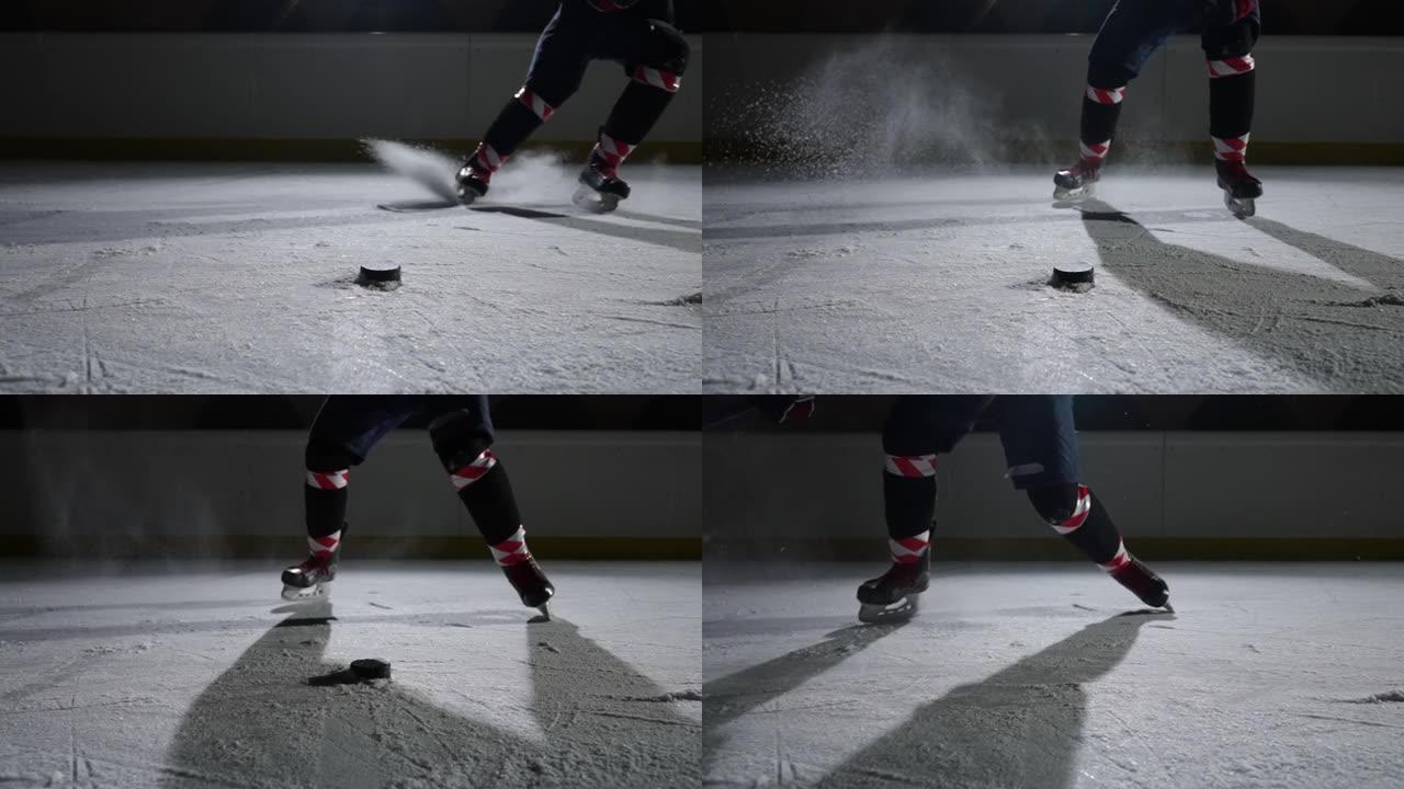 滑冰者在冰上滑行时跟随曲棍球运动员的脚。用棍子击中冰球并进球。运动员在聚光灯下在黑暗冰冷的竞技场上滑