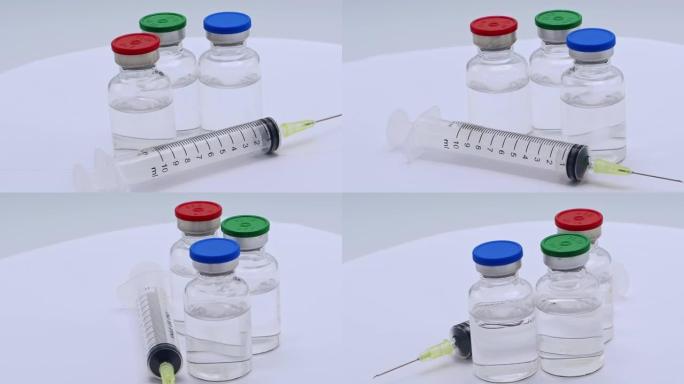 疫苗注射器和瓶子应该放在白色背景上旋转。