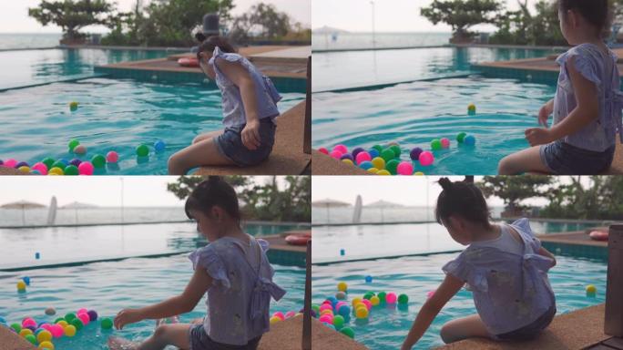亚洲女婴在游泳池玩耍