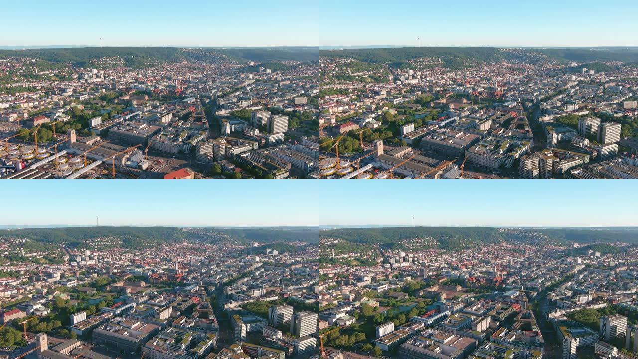 斯图加特: 日落时德国城市的鸟瞰图，城市中心融合了现代和历史建筑，广场Schlossplatz和新宫
