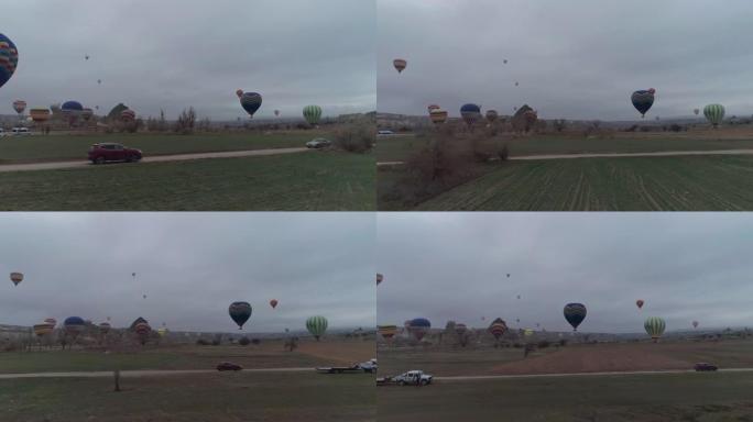 深红色SUV通过热空气气球飞行，jb01