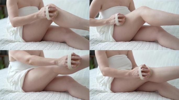 女性身体与脂肪团的特写，女人用手对脂肪团进行自我按摩