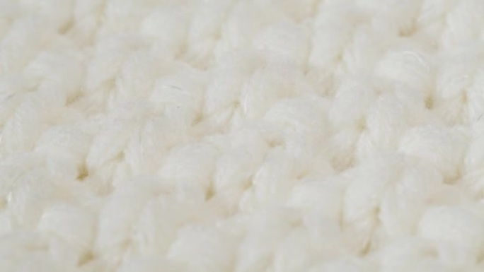 白色针织布，浅色羊毛衣服面料特写，编织纺织背景