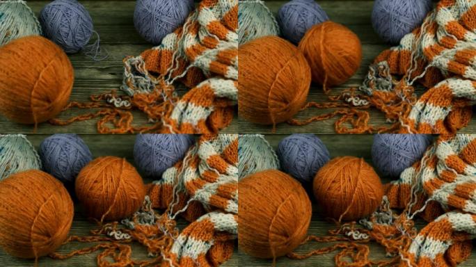 针织线，针线活用的羊毛线，在木桌上滚动的橙色线球，