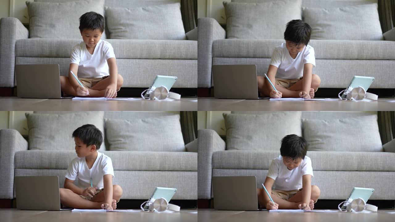 亚洲孩子用耳机学习在线学习。新常态的概念研究与检疫