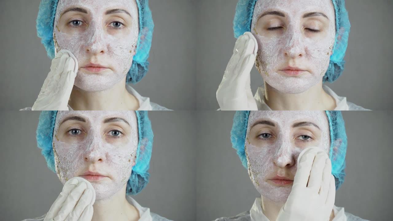女性在专业激光表面修复后在受损的面部皮肤中擦再生霜