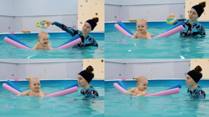 女孩游泳教练向孩子倒水。快乐的孩子学会不怕水。