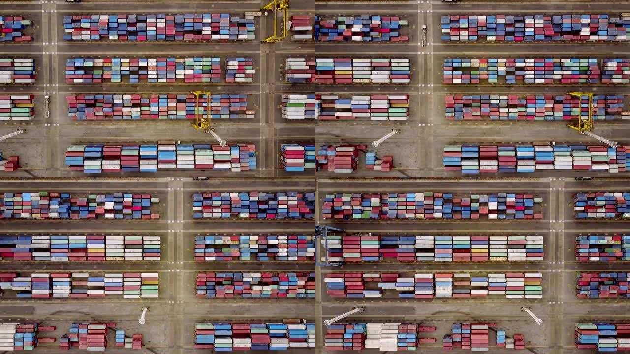 印度尼西亚雅加达。2017年7月10日: 丹绒普里约克港装有起重机和卡车的货物集装箱的俯视图镜头。以