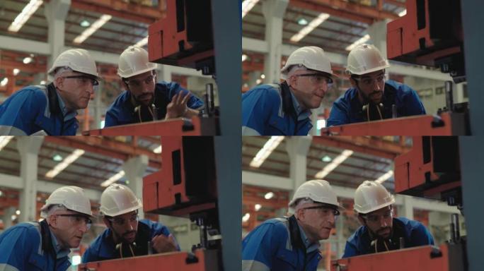 teem工程师在工厂车间讨论质量检查员的4k视频片段